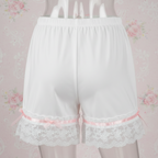 White lace Satin Sleep shorts on a floral patterned background