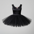 A black sleeveless tutu dress with a nylon tricot bodice, scalloped lace trim, and a full layered tulle skirt, featuring a small pink bow at the neckline, shown against a light gray background