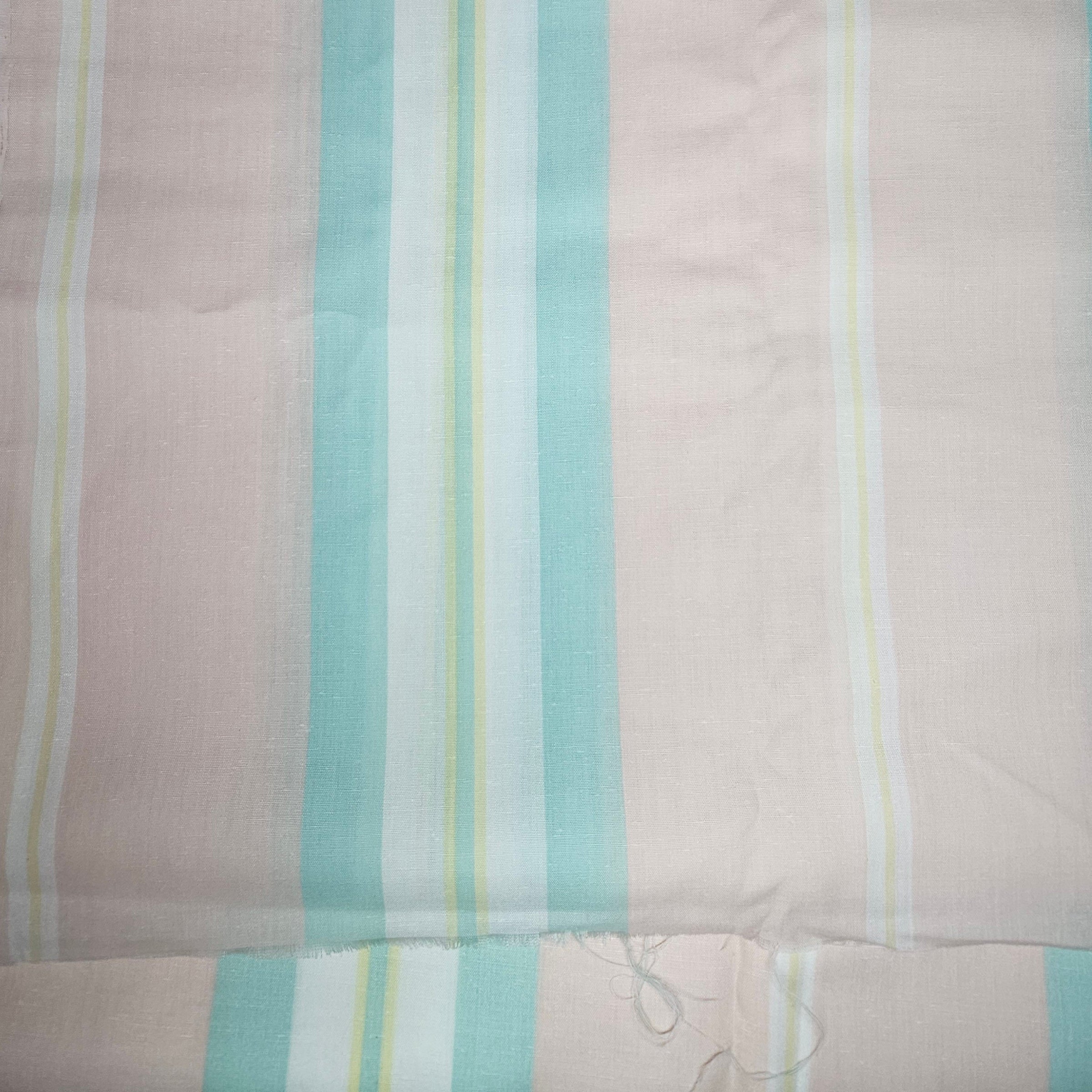 Striped fabric with pastel colors on a Peach background