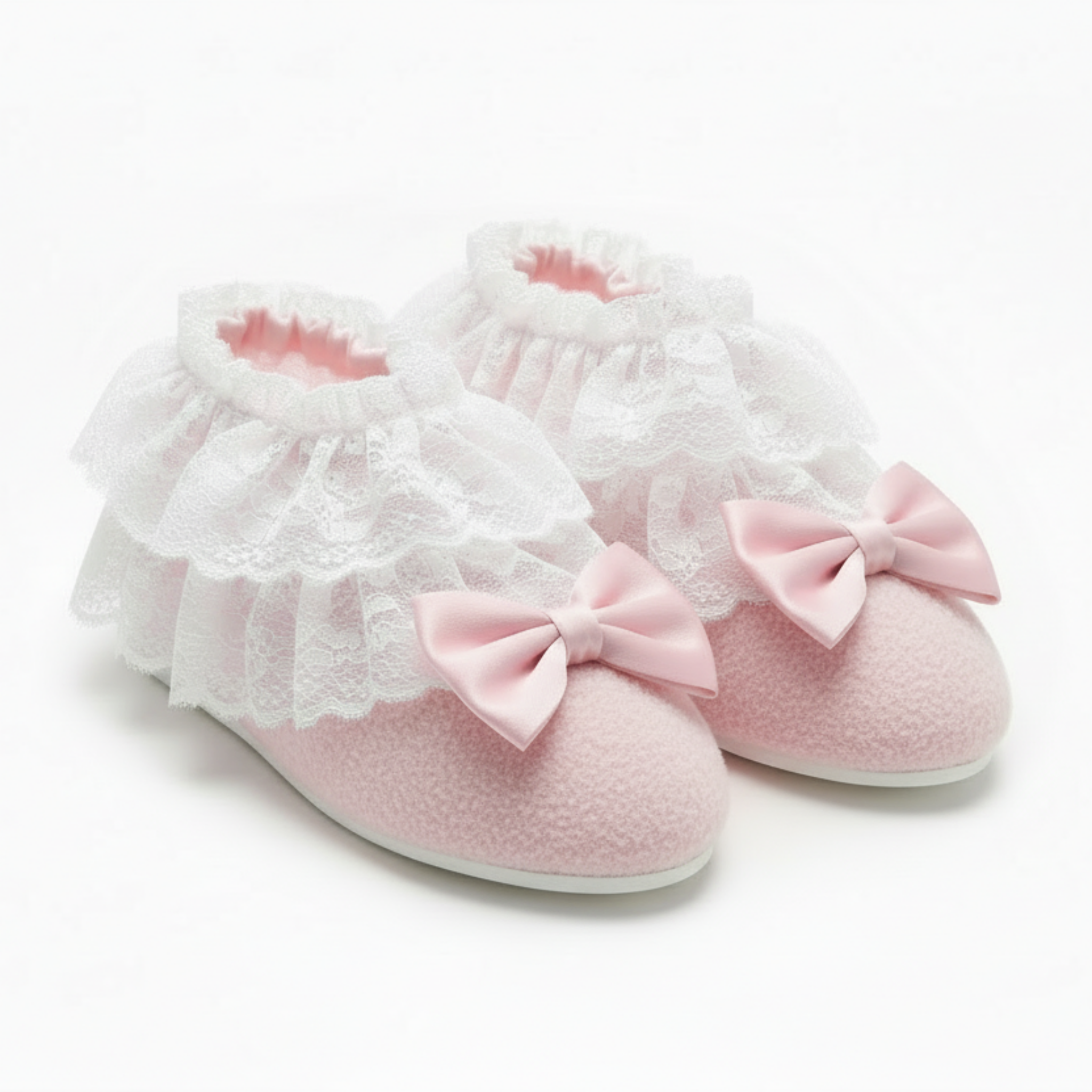 Pink booties with white ruffles and pink bows on a white background