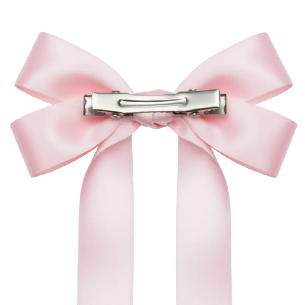 Pink satin bow on a white background