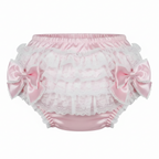 Pink rhumba panties with lace and bows on a white background