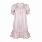 Pink nightgown with lace details on a white background
